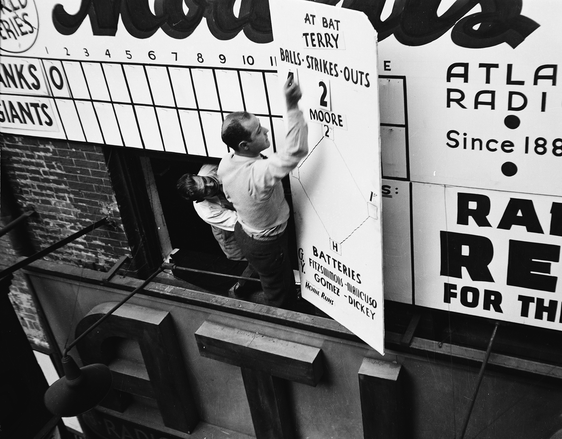 World Series announcement board (Yankees vs. Giants), Radio Row, Cortlandt Street, 1936. WPA Federal Writers' Project, NYC Municipal Archives.