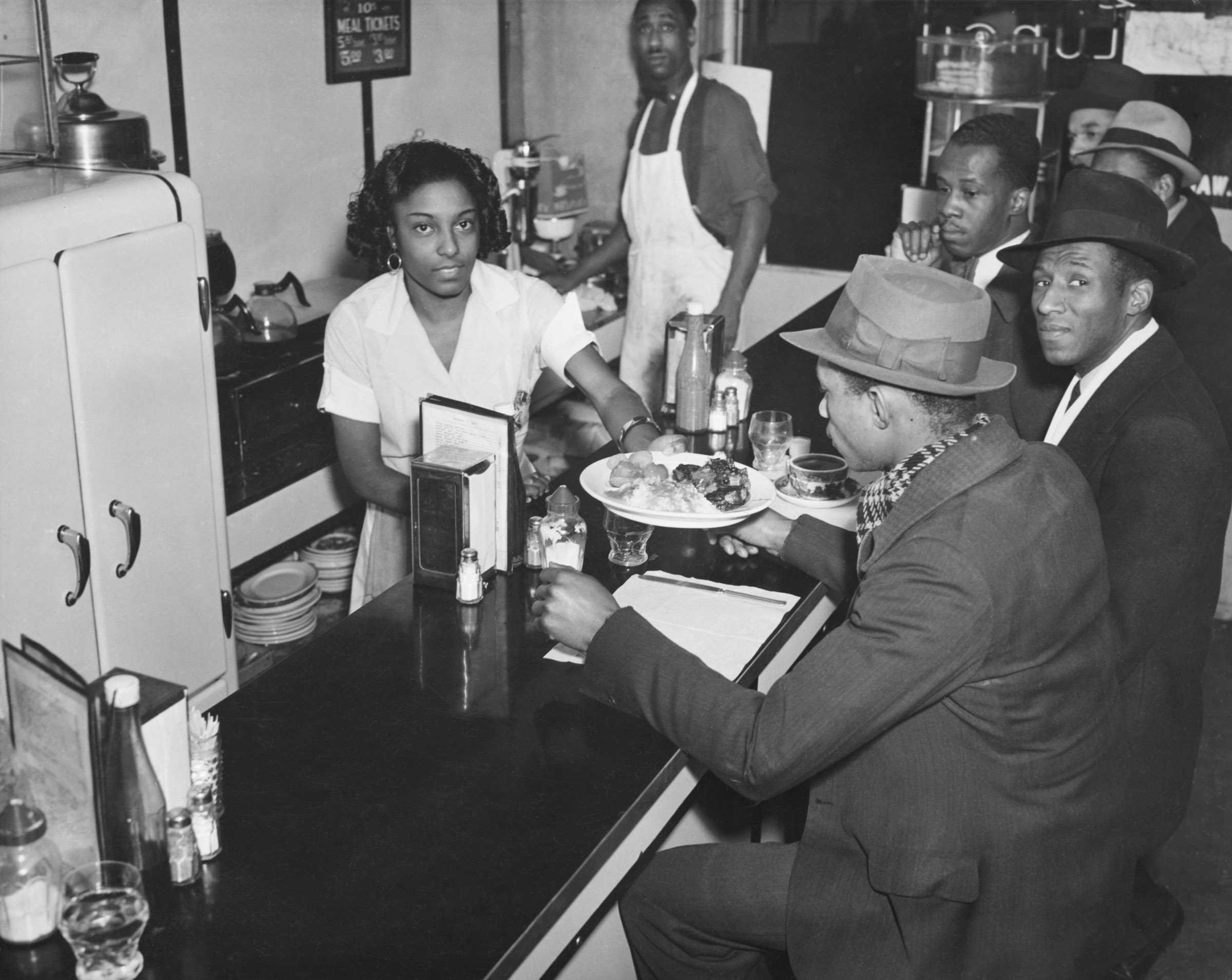 Counter of the Unique Lunch, 195 West 135th Street. Date: December 14, 1937. Photographer: Aubrey Pollard. WPA-FWP Collection, NYC Municipal Archives.