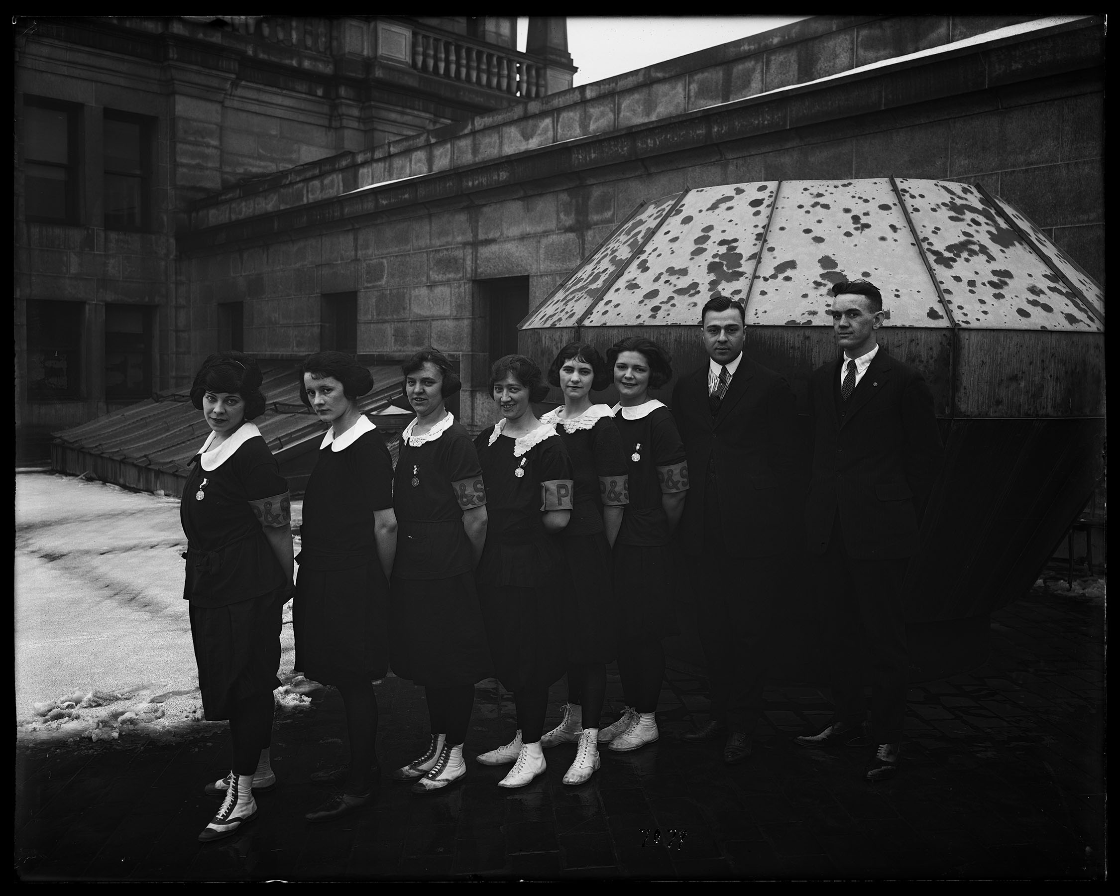 BPS_07079: Basketball Team, taken on roof of Municipal Building, March 2, 1922. Photo by Eugene de Salignac, Department of Bridges, Plant and Structures Collection, NYC Municipal Archives.