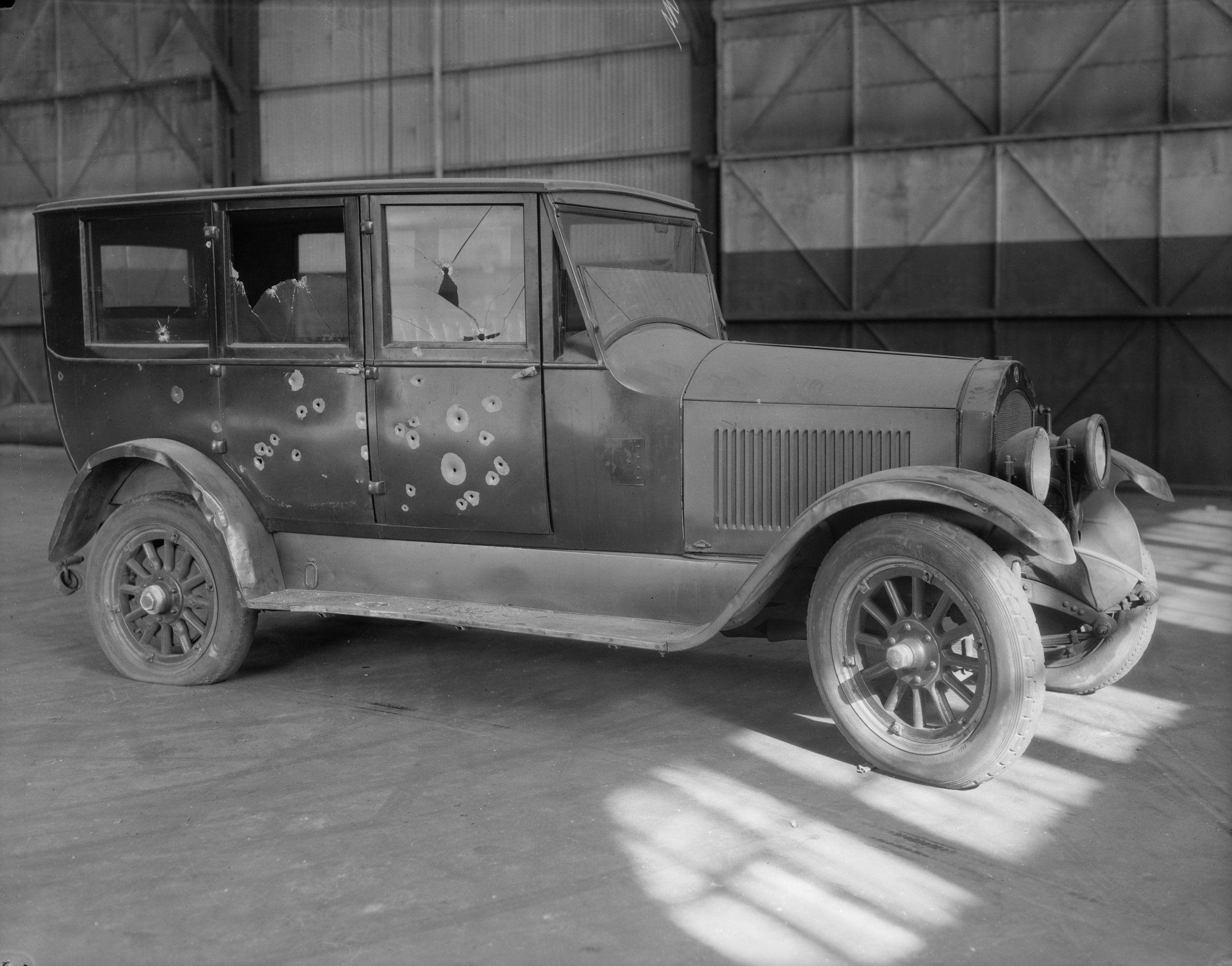 NYPD 8529a: Automobile, showing bullet holes taken on East 25th Street pier for Insp. Noonon, October 27, 1926. E. Tobin, NYPD Collection, NYC Municipal Archives.