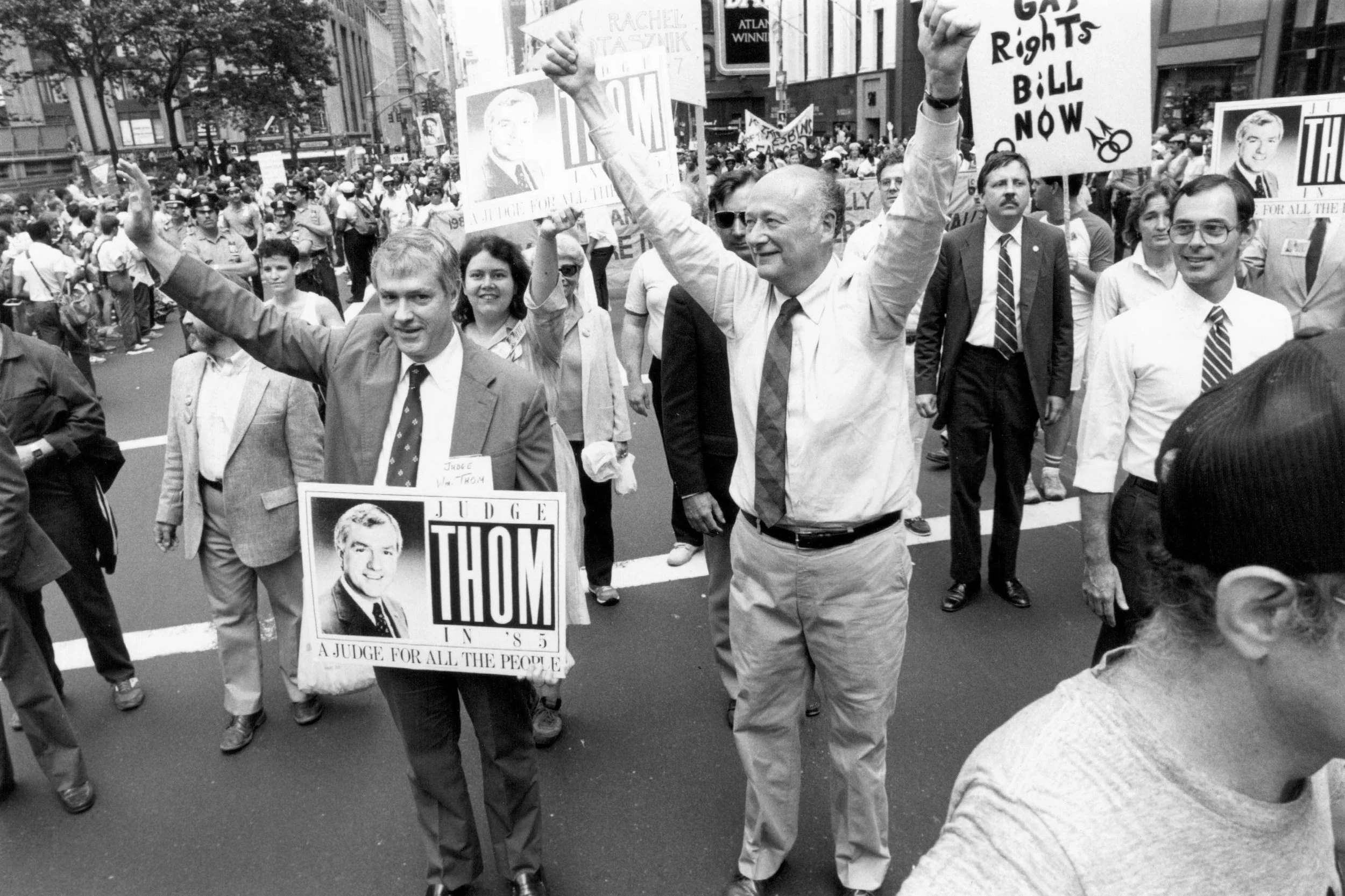 Mayor Edward Koch marched in the 1985 Gay Pride parade with Judge Willliam Thom, New York’s first openly gay judge. June 30, 1985. Photographer: Holland Wemple. Edward I. Koch Collection, NYC Municipal Archives.