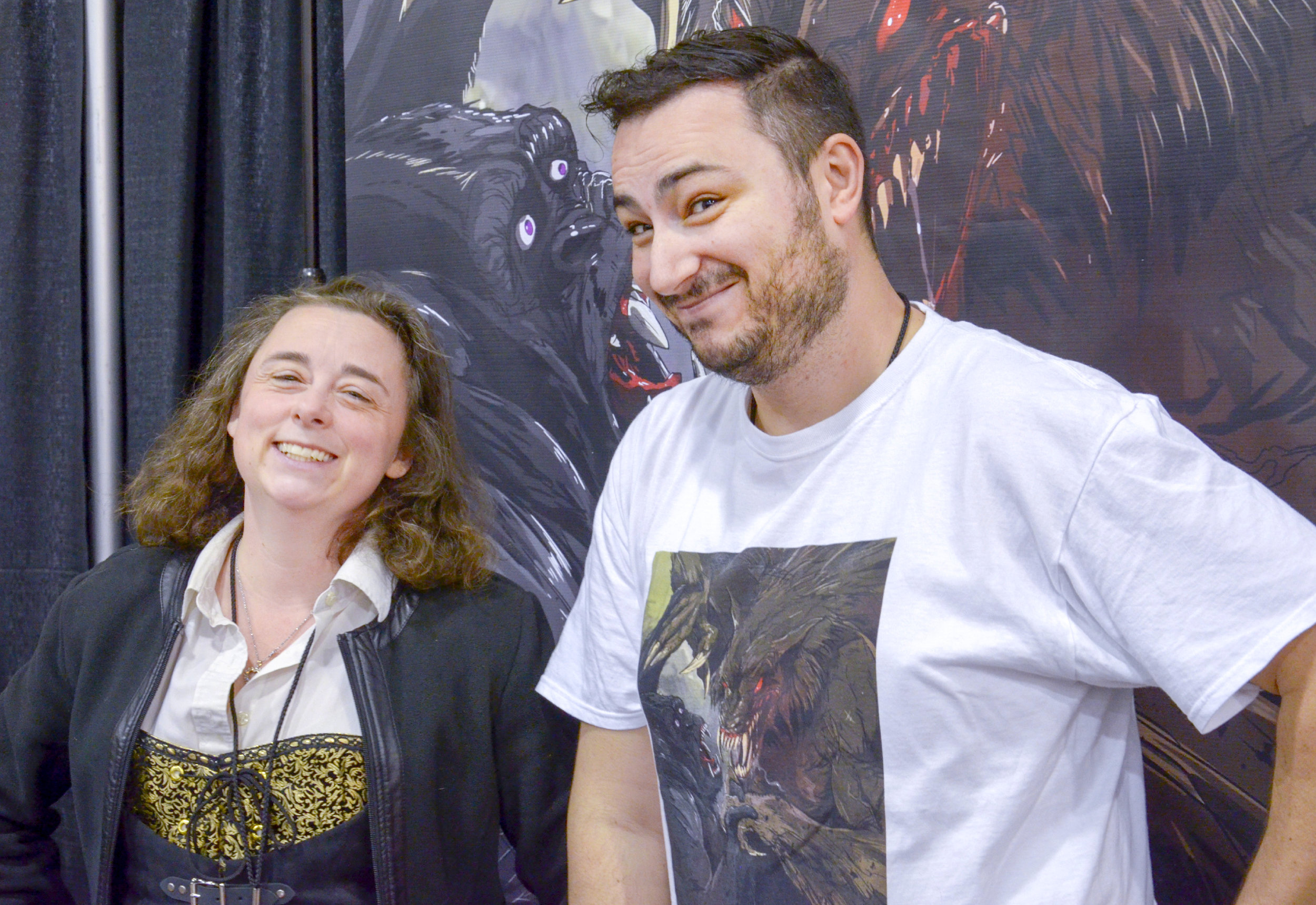 L to R: Chris Cam and George Michail at the 2019 Calgary Expo for their book: Cover of Darkness (Photo credit: Charles Cousins/GeekNerdNet)