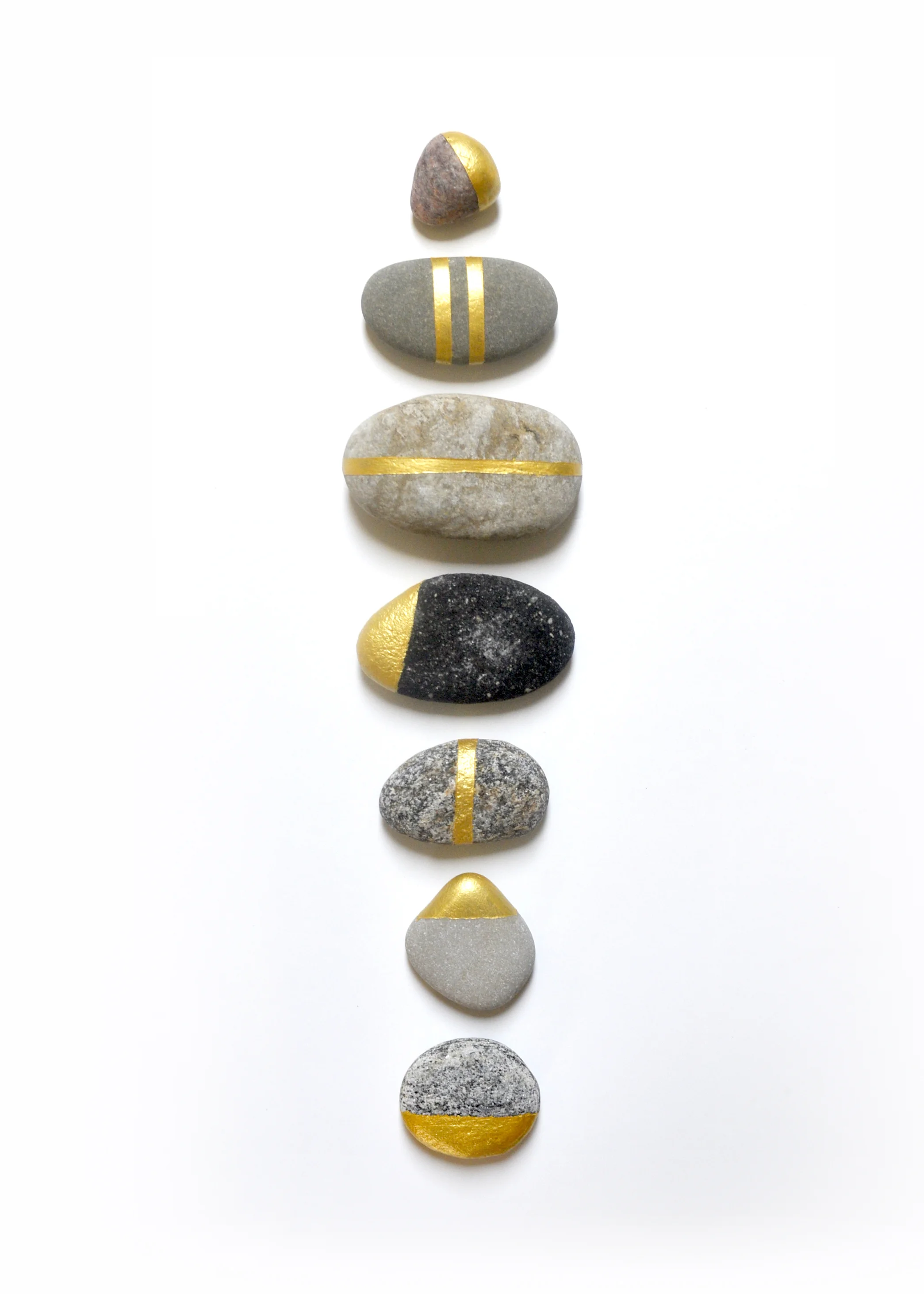 Gold painted rocks by Swell Made Co.