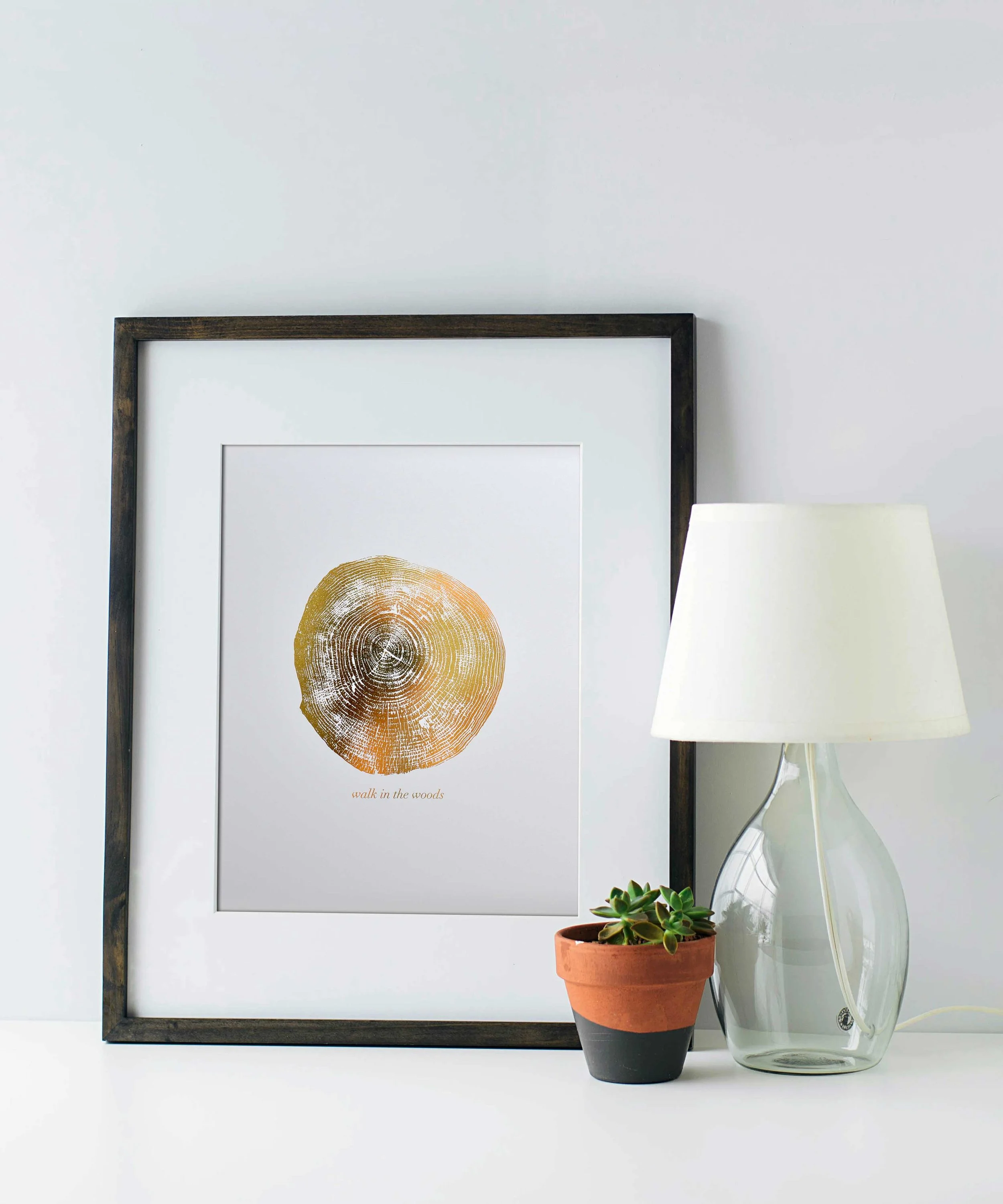 Walk in the woods gold foil art print with dark frame. By Swell Made Co.