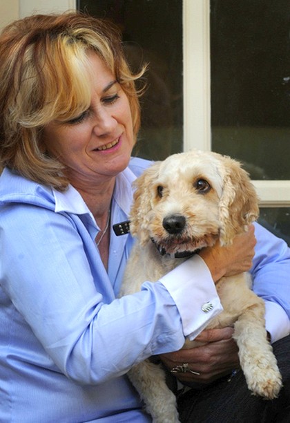 Not just a cute pooch ... Mary Jo McVeigh and Toby provide animal assistance therapy.