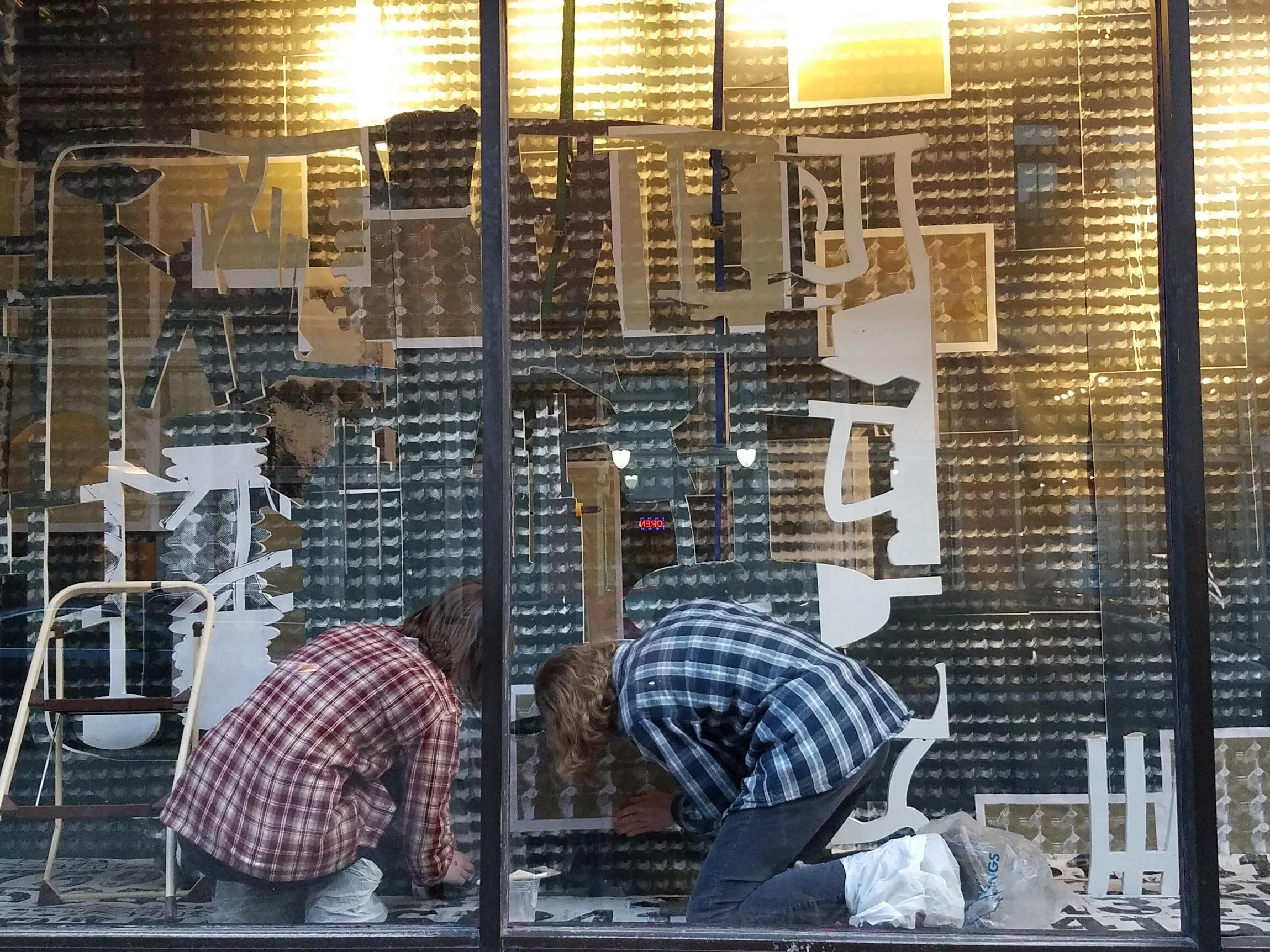 Assembly and installation of The Anatomy Lesson in SPACE gallery's window