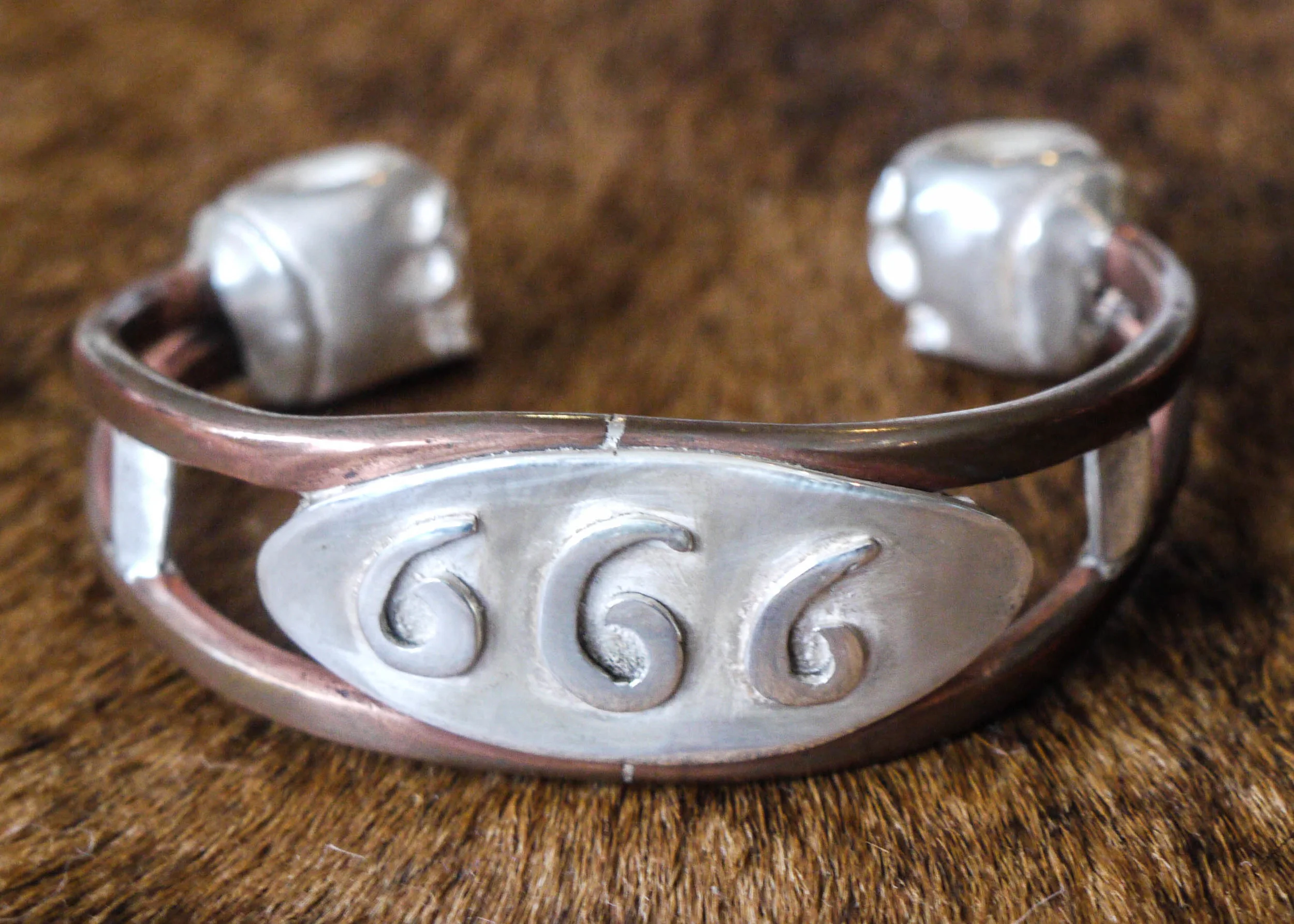 666 copper and silver bracelt with skulls