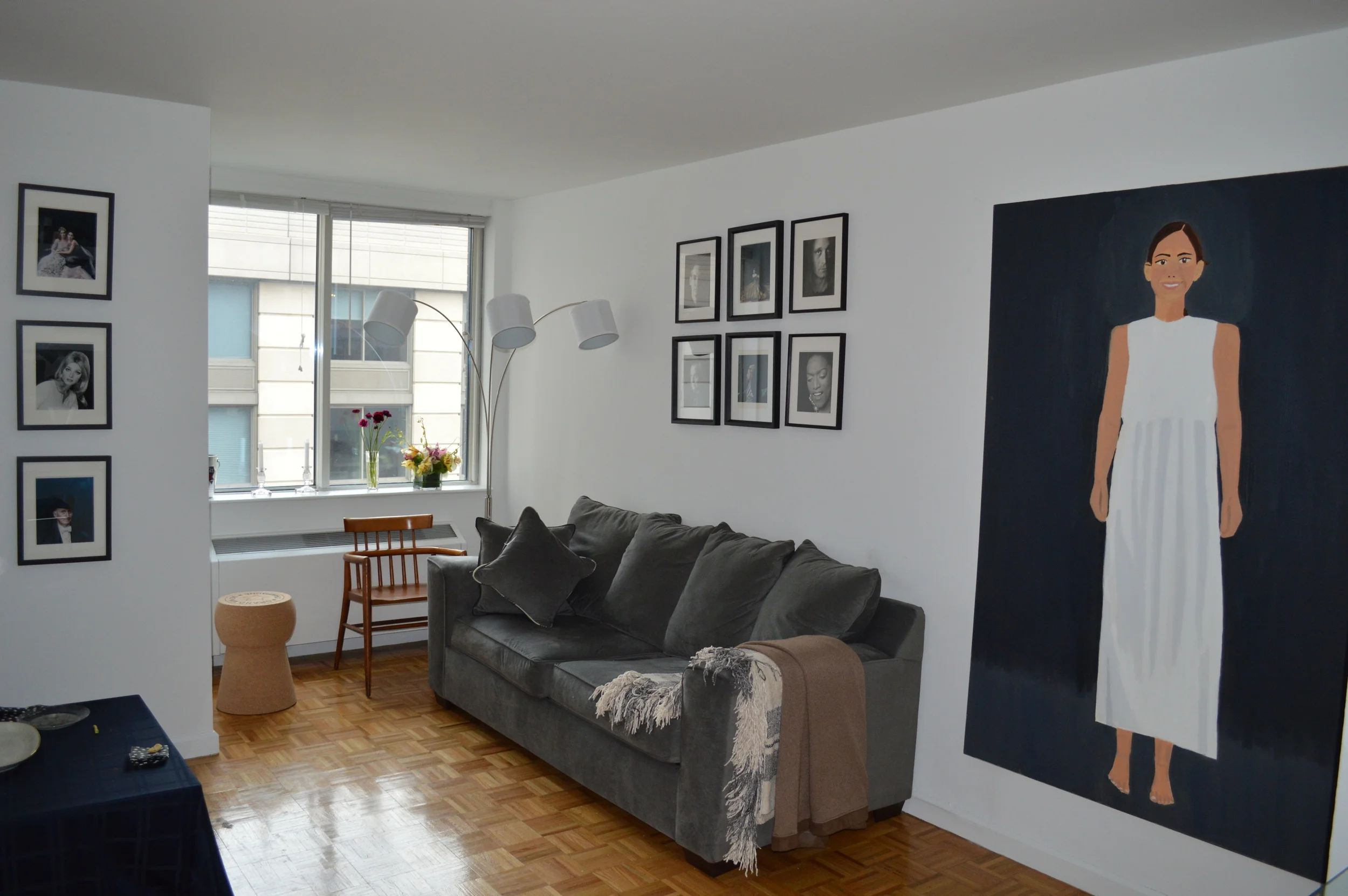 The living room of my apartment: a collection of David Seidner portraits from his Faces of Contemporary Art and Sargent's Bloodlines series, as well as a portrait I painted while I was in college. 