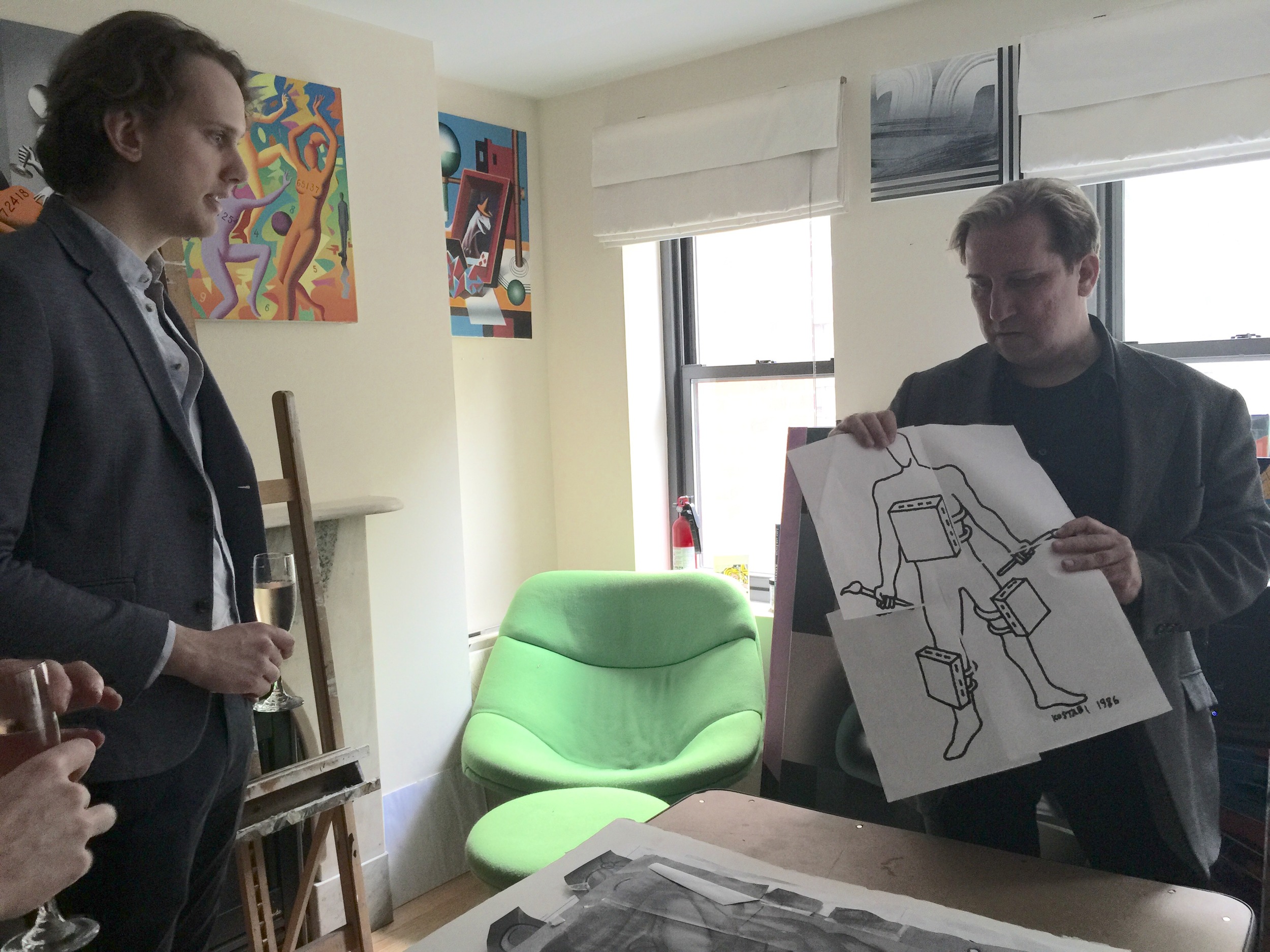 Mark showing his drawings to members and guests. 
