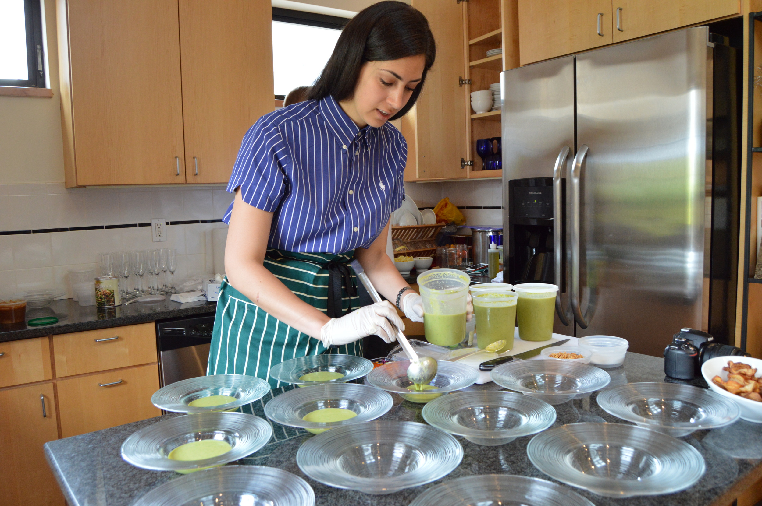 Stephanie Nass plating the asparagus soup