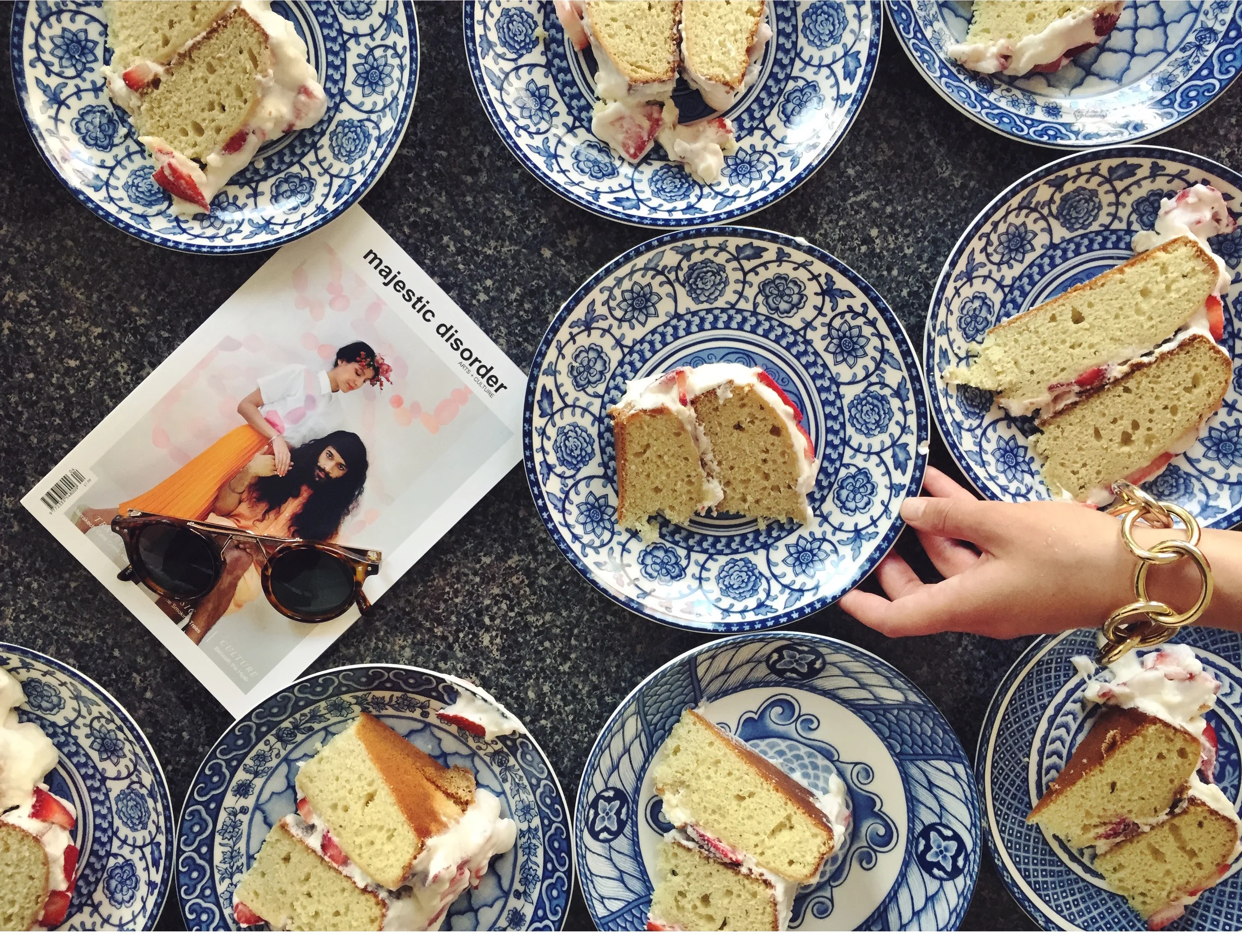 Stephanie plating strawberry shortcake with majestic disorder magazine Issue IV (image via @majesticdisorder )