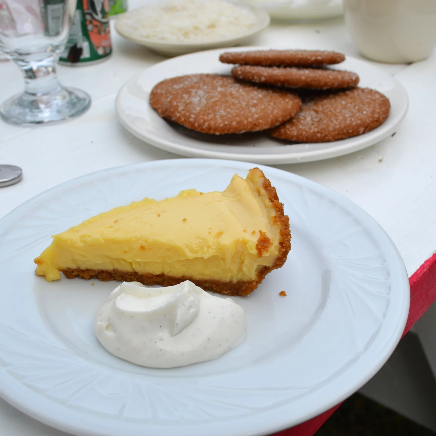 Key Lime Pie with a side of Misha Dairy 's Vanilla Coconut Quark. Behind are Eleni's gingersnap cookies. 