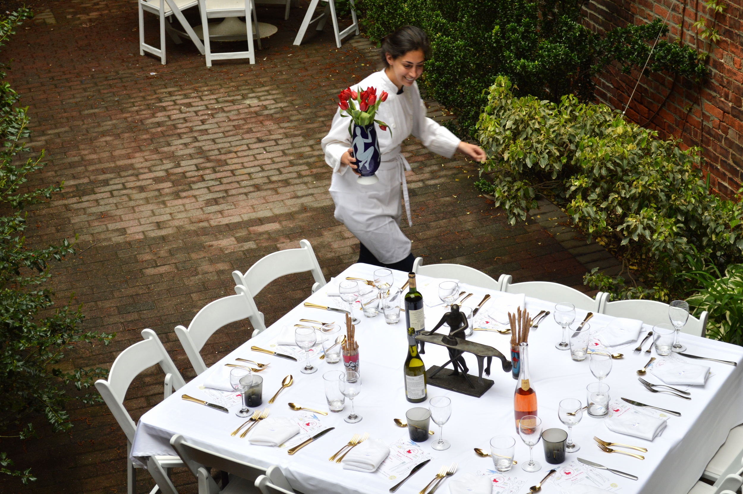 Chefanie setting the table for our event at Kostabi world