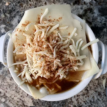 Cheese on soup prior to broiling