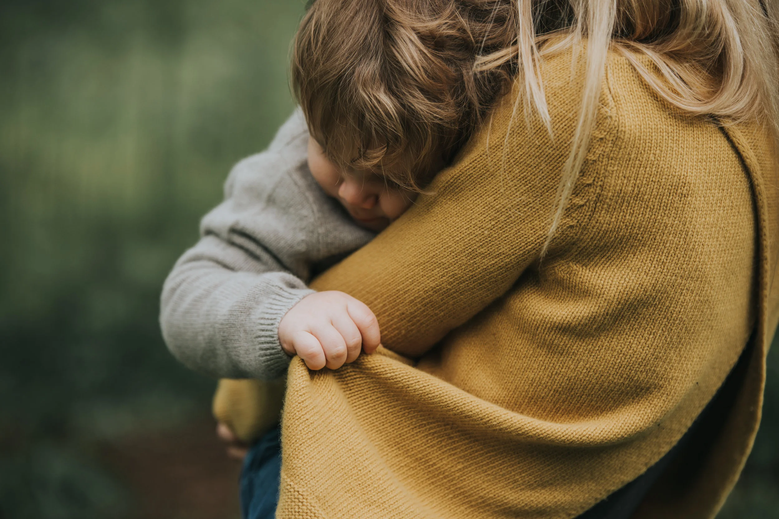 I love the emotion in this image, Ted looks so comforted by being in his mother's arms.