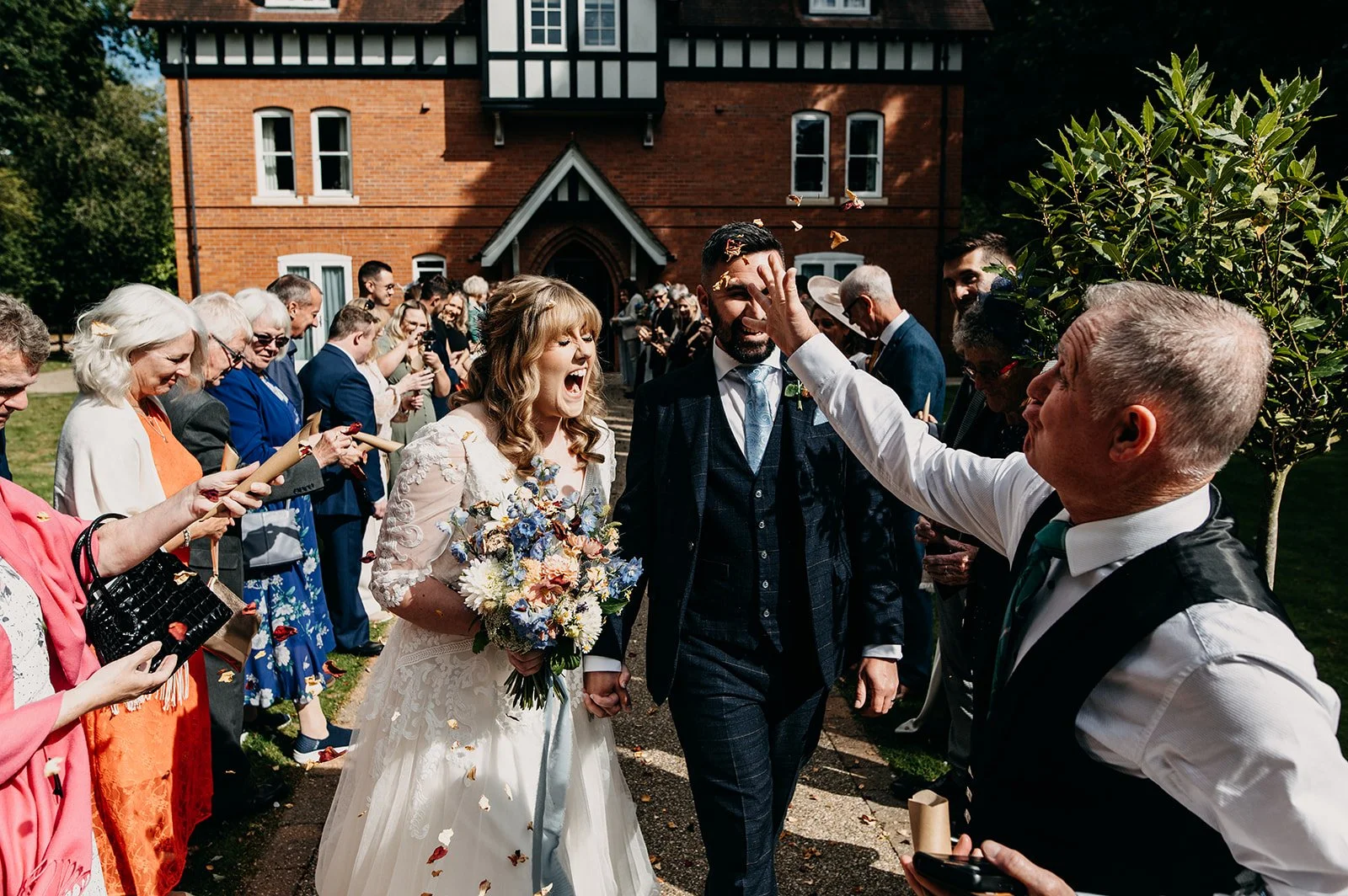 fun confetti photo - Woodhall Spa documentary wedding photography at the Dower House Hotel