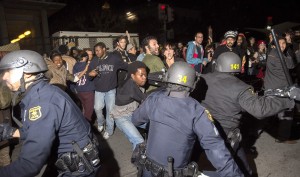 Protesters and police clashed Saturday during demonstrations against police brutality in the Mike Brown and Eric Garner cases. Several members of the press were assaulted by police officers wielding batons. Photo courtesy NBC news/2014.