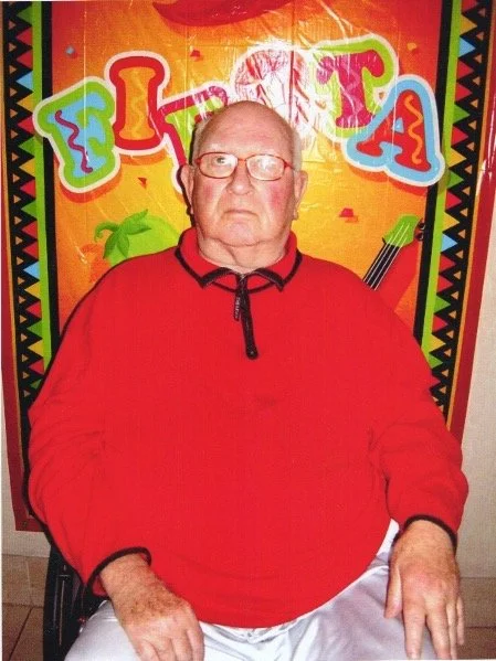 Another Man in front of mural.JPG
