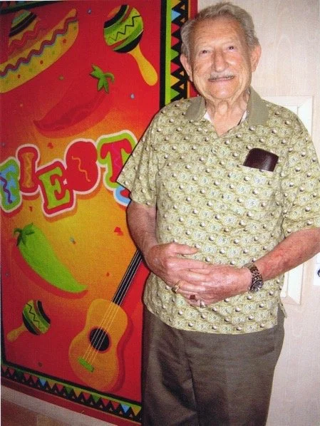 Man in front of Mural.JPG