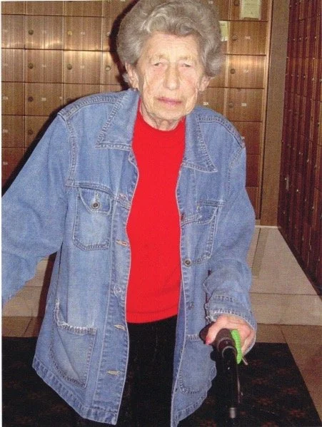 serious woman with cane.JPG
