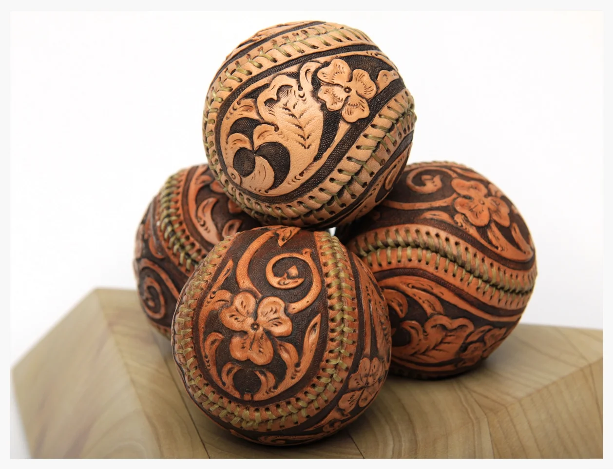 8b.Three leather tooled baseballs on pyramid 2.jpg