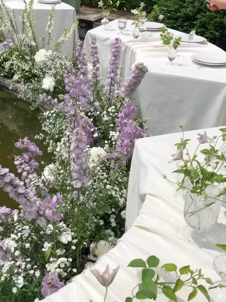 Delphinium in June⛲️🌱
.
If the perfect shades of lavender exist they would be these early summer delphinium and clematis 
.
Clematis, fresia, peony, aster and delphinium surrounding @thebakkenmuseum fountain designed by @ever_weddings 
.
Venue @theb