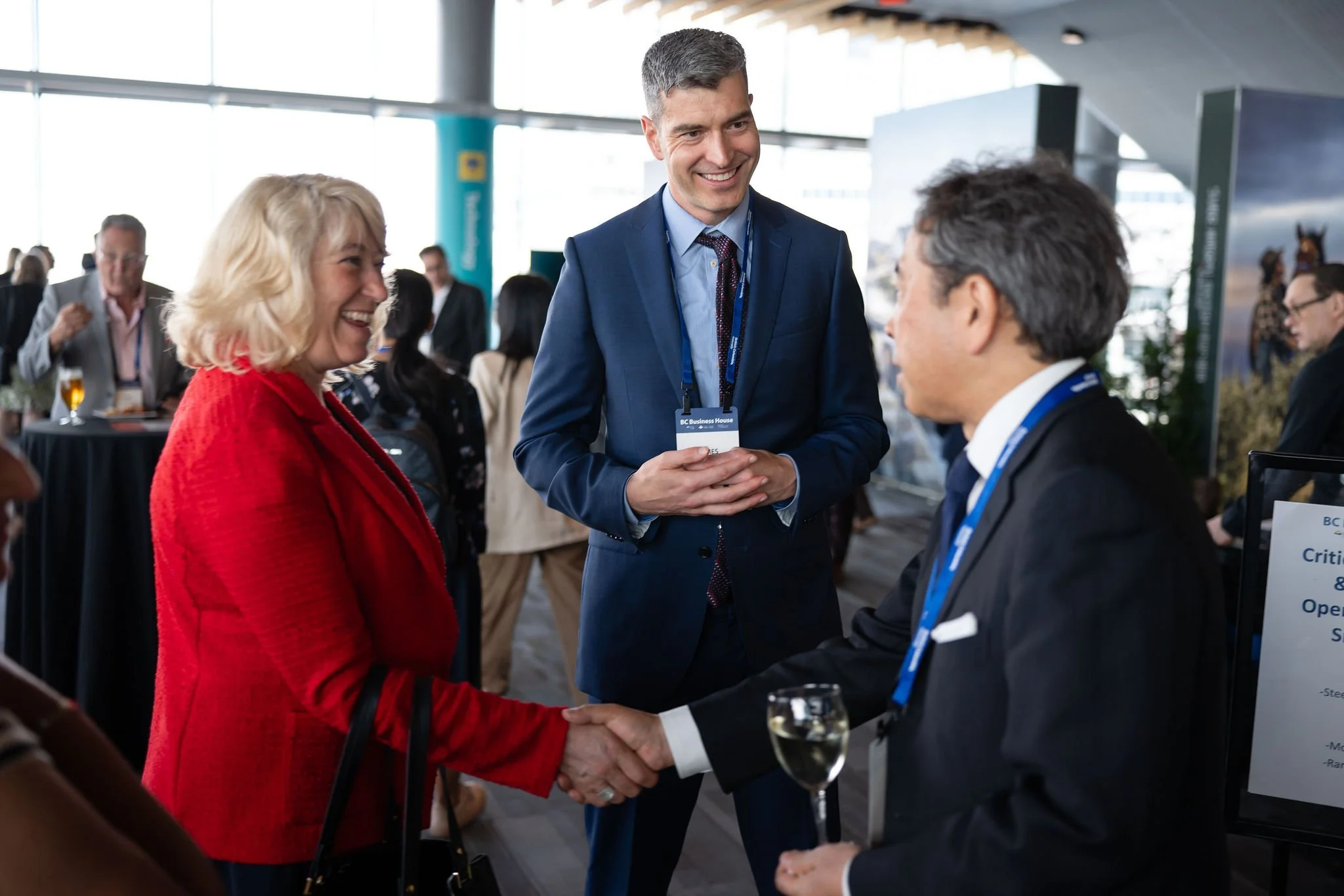 Guests greeting one another during a Vancouver networking reception