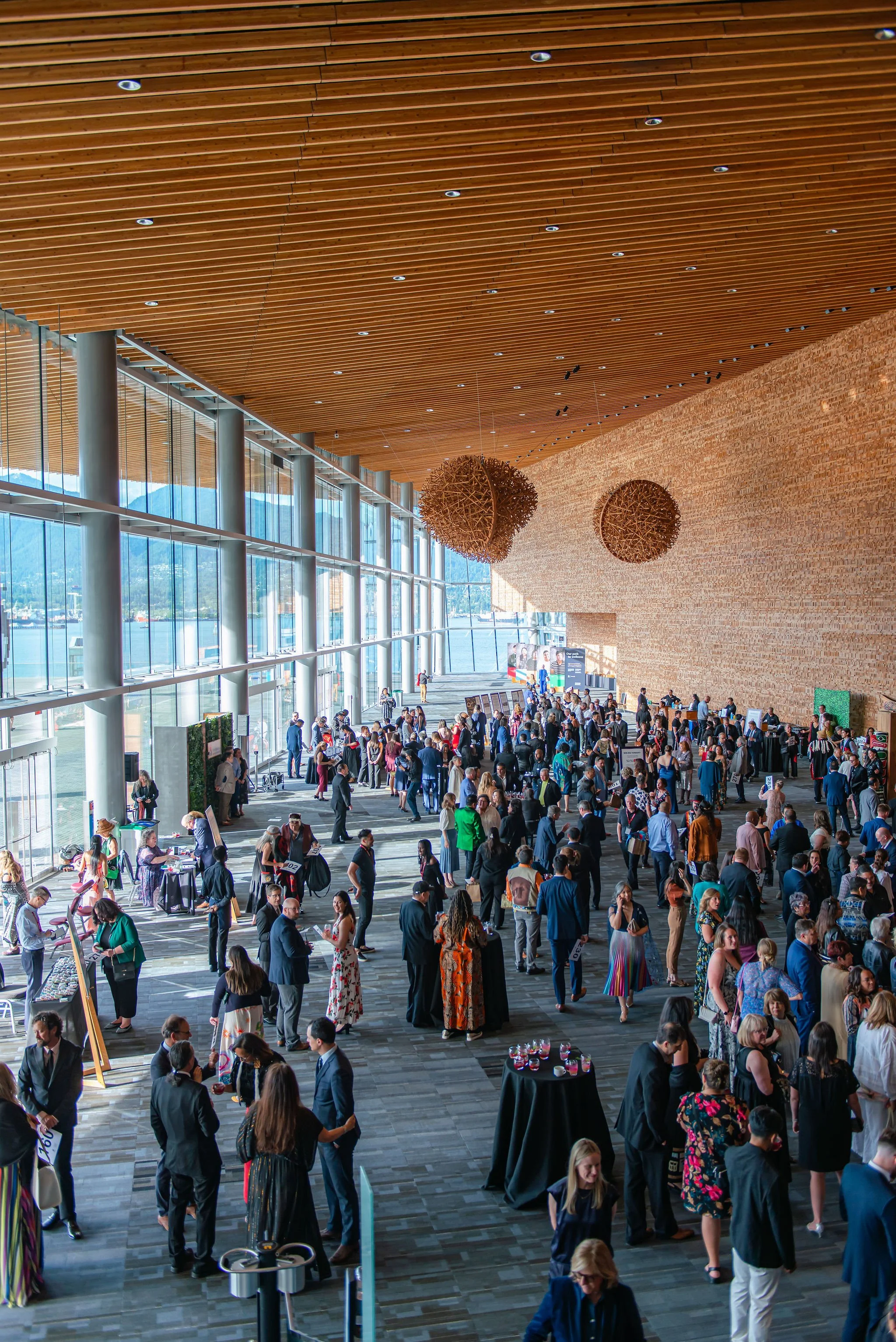 Guests networking in the atrium of the Vancouver Convention Centre (Copy)
