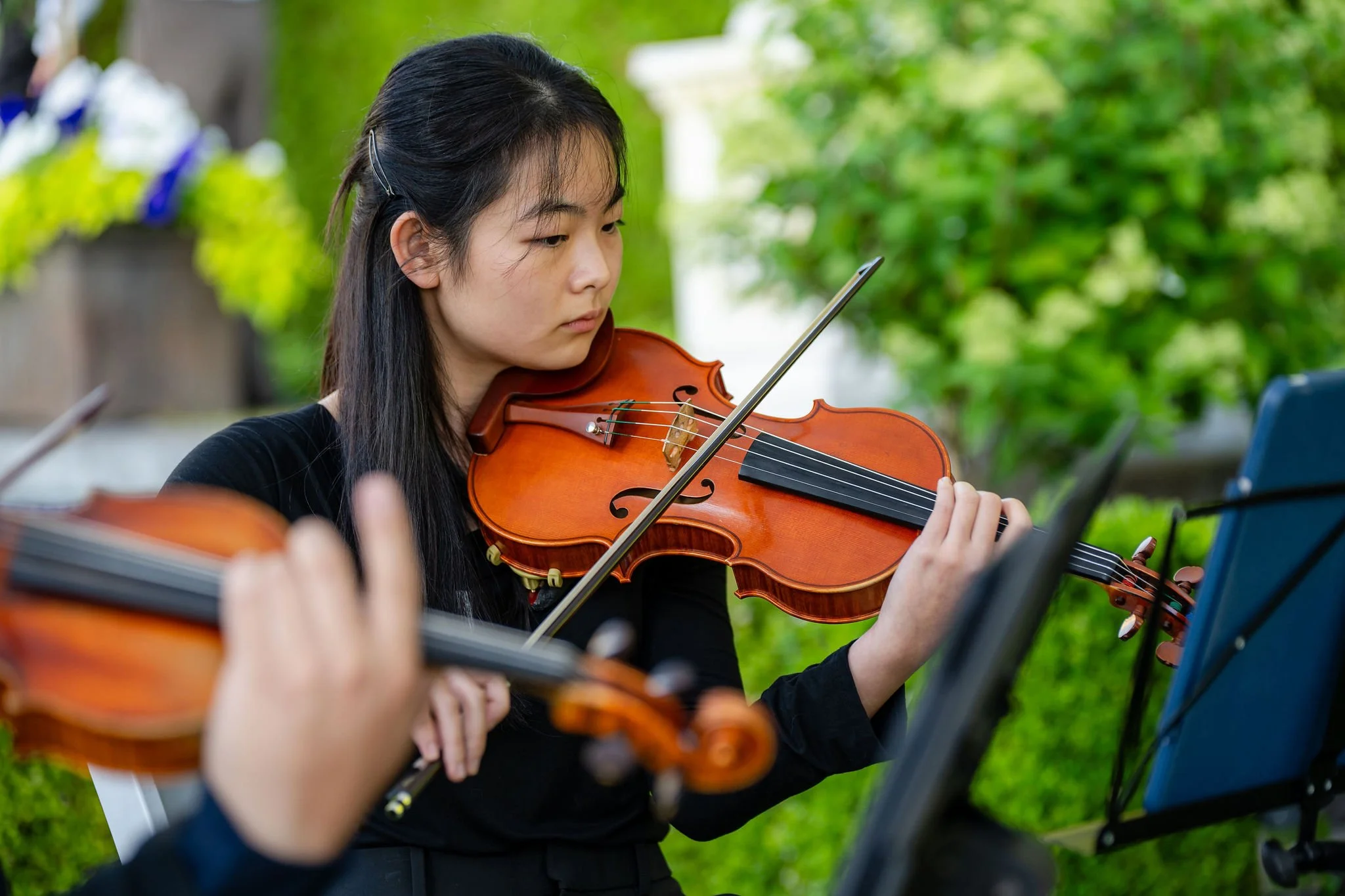 Violinist performing outdoors at a Vancouver event