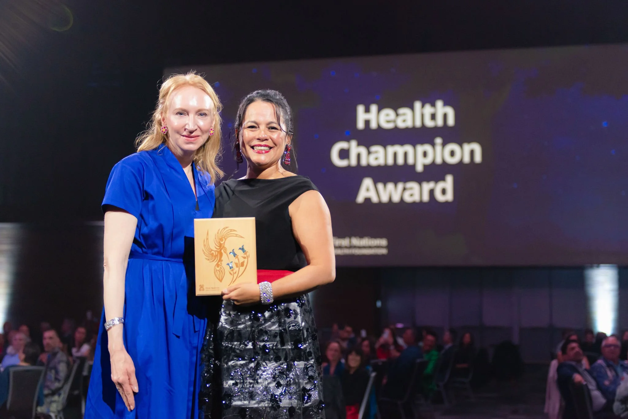 Health Champion Award recipient posing with the award presenter