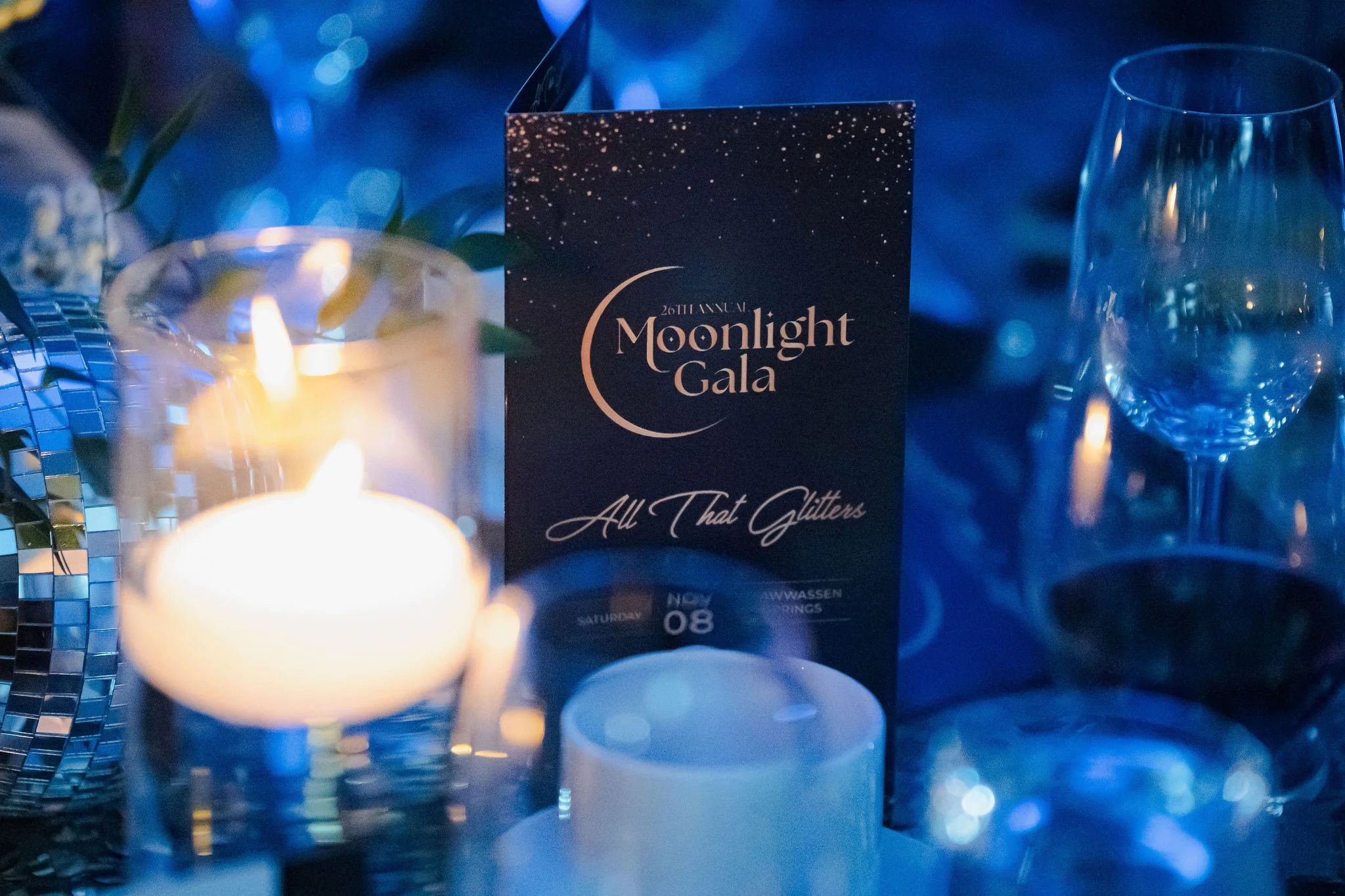 Candlelit Moonlight Gala table setting with event menu