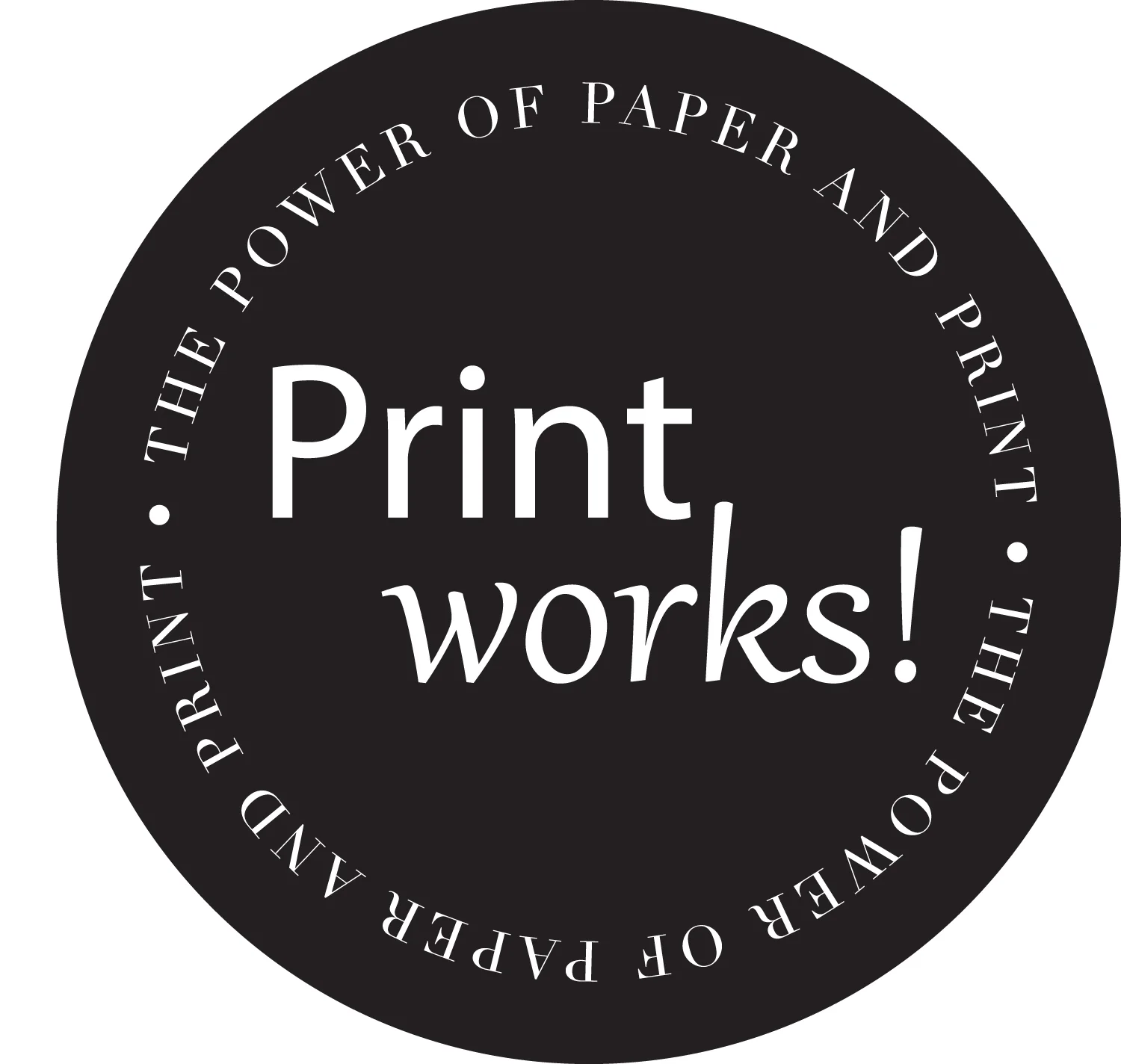 Black circular badge with white text that says 'Print works!' in the center, surrounded by the phrase 'The power of paper and printing' repeated around the edge.