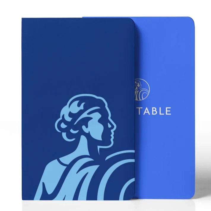Two blue menus or folders, one with a classical statue profile and the word 'TABLE' on the other.