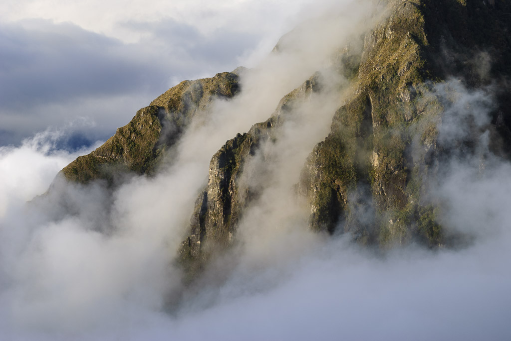 Late afternoon clouds creep up from the valley, Andes Mountains, Peru