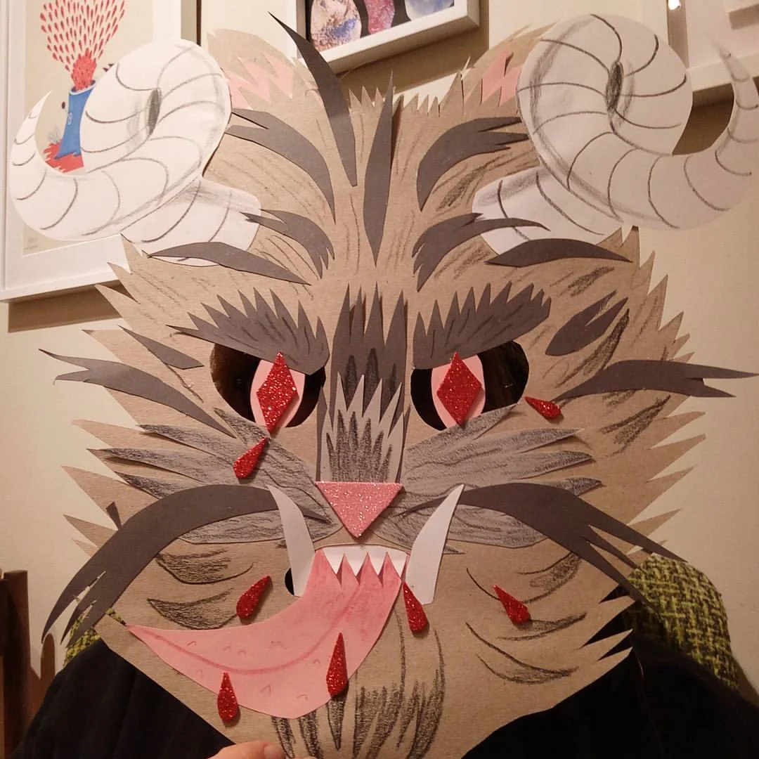 Krampus mask - pencil and coloured pencil on paper and glitter foam. Personal experimentation / teaching example.