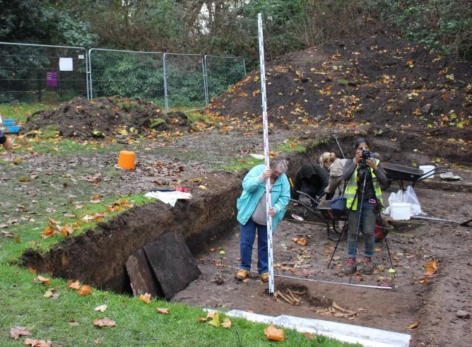 Sarah and Natasha measuring the dog skeleton unearthedduring the Dovecote Dig