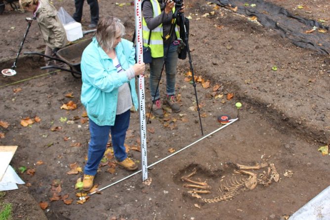 Sarah at work measuring the dog skeleton - one of the most fascinating finds of the dig
