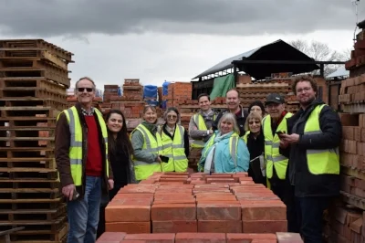 A group of volunteers and Palace management at H. G. Matthews' expert brick makers