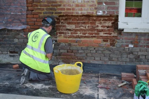 One of the SSH Conservationist carrying out the Palace's brick restoration