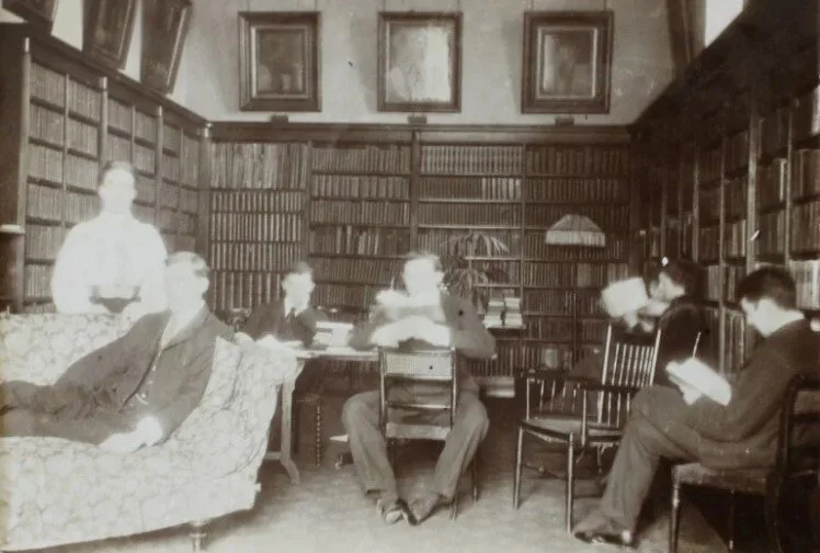 The library in the late nineteenth century - we believe the family pictured are the Creightons