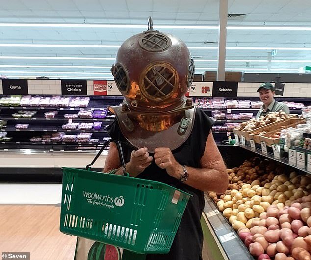 Shopping in full protection (Image sourced from Internewscast.com, 2020, https://internewscast.com/shopper-wears-a-diving-helmet-while-browsing-for-potatoes-at-a-woolworths-supermarket/)