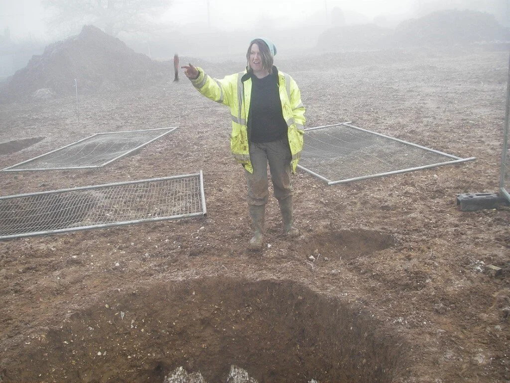 Becky casts her trowel into an Iron Age grain storage pit in Basingstoke.