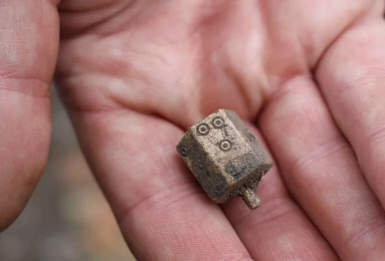 A six-sided Tudor teetotum made from antler between 1480 and 1550. Teetotums were spinning tops used in gambling games. Discovered by volunteer archaeologist Simon Butt during our Dovecot Dig in 2017.