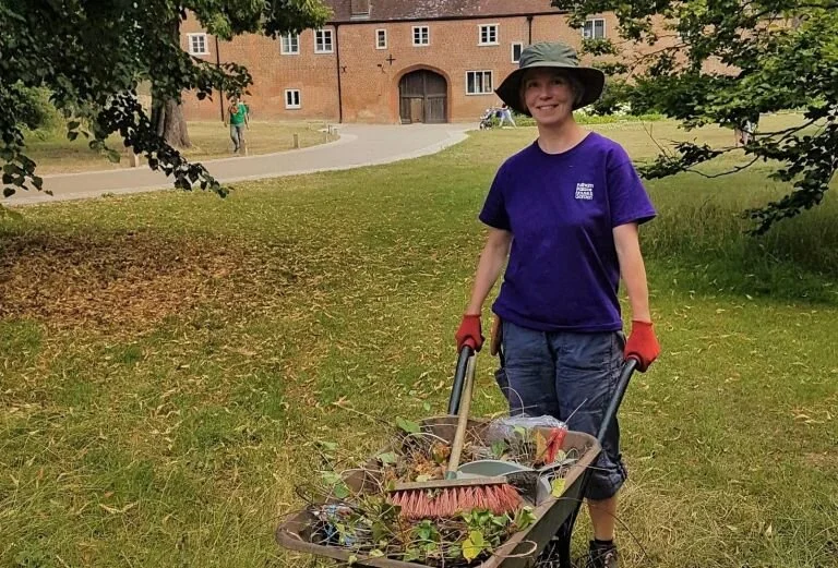Garden apprentice Annette Förger and her wheelbarrow.