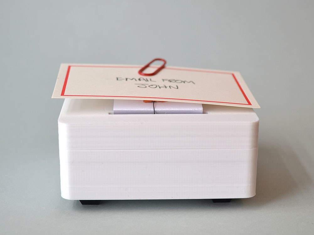 This gadget by Brendan Dawes quietly raises a handwritten note at the appropriate moment in lieu of a digital notification. | Brendan Dawes