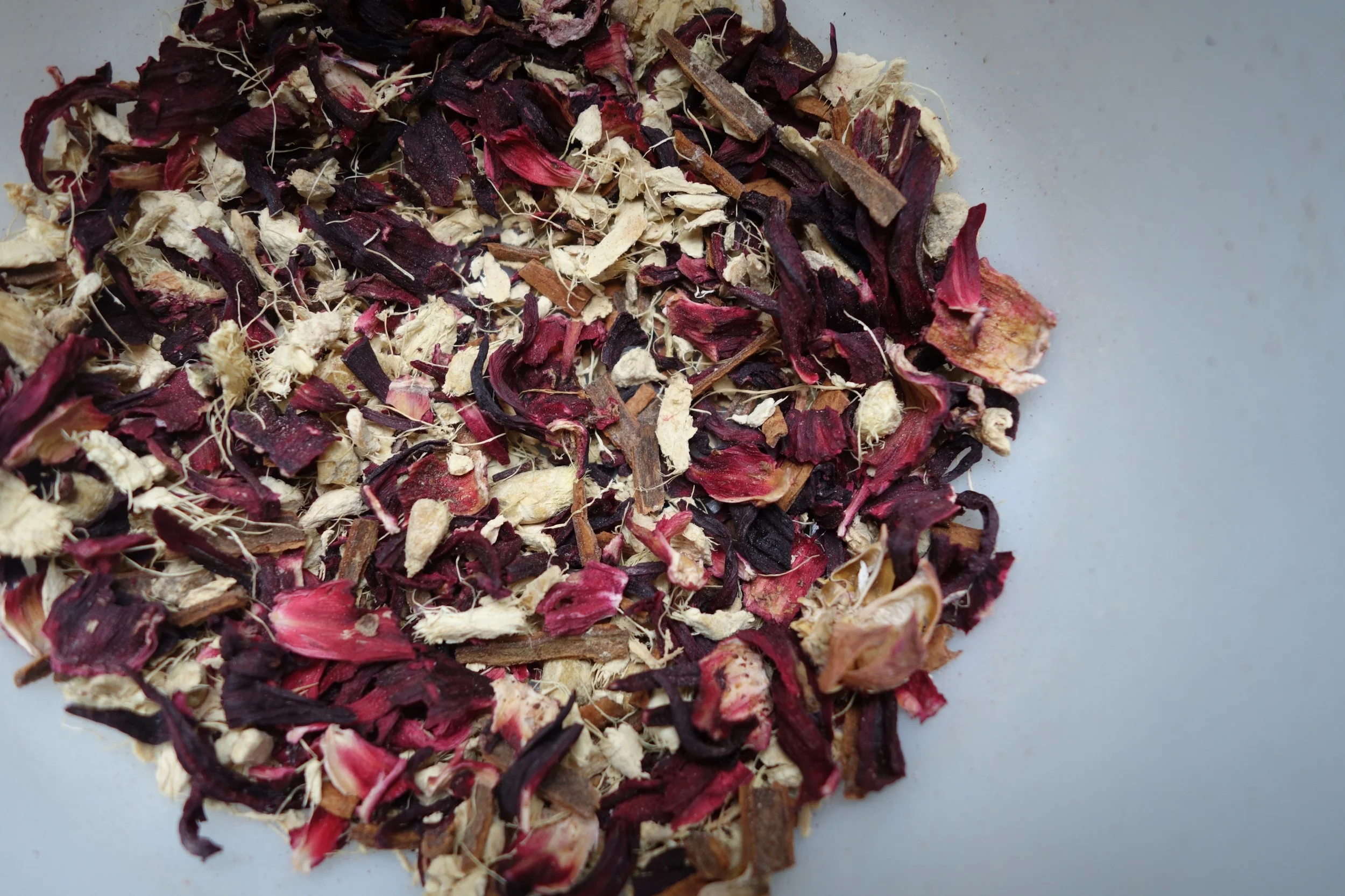 This is a digestive and purifying tonic made with hibiscus, ginger root, and cinnamon.