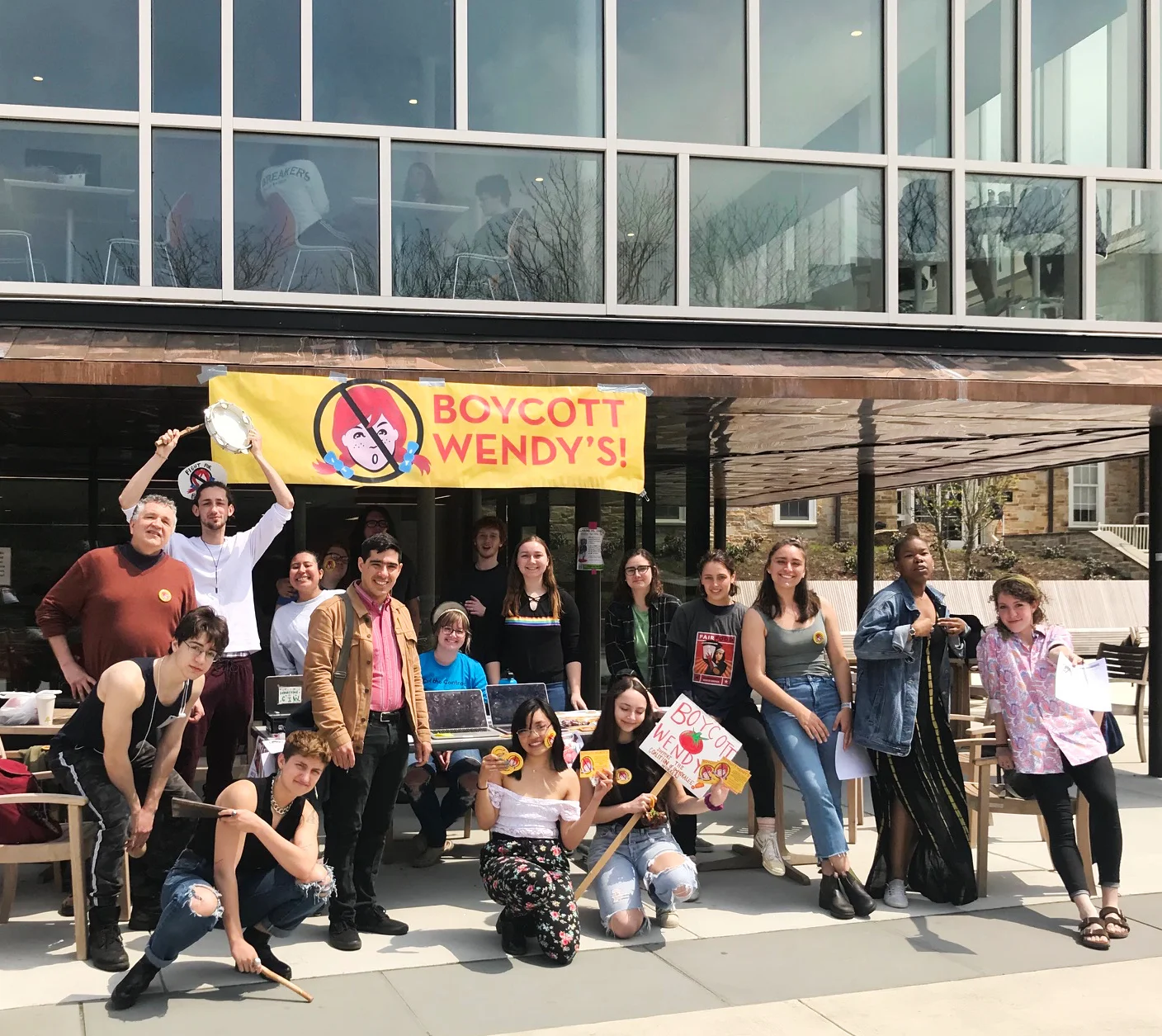 Students at Goucher College in Baltimore drop a banner from the Mary Fisher Dining Center as part of the Student/Farmworker Alliance’s “Wendy’s, We Won’t Yield” National Day of Action on April 18, 2019.