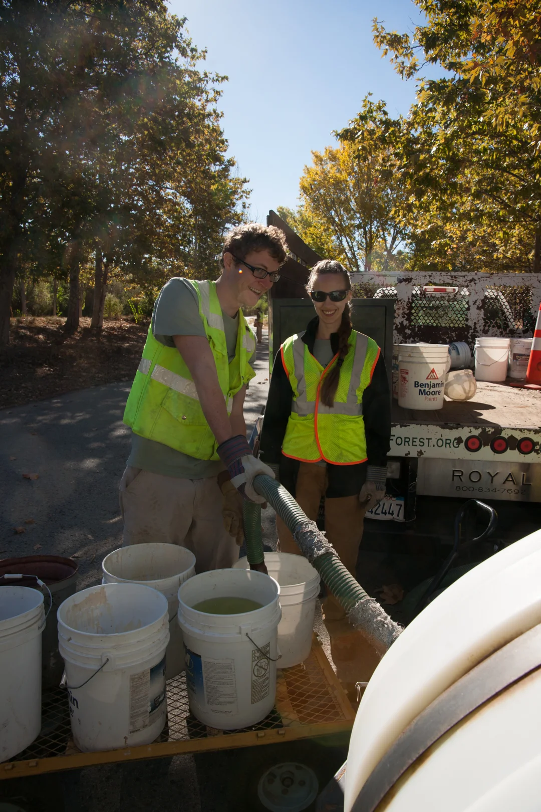 Pictured: Two OCF Americorps members watering trees in a drought