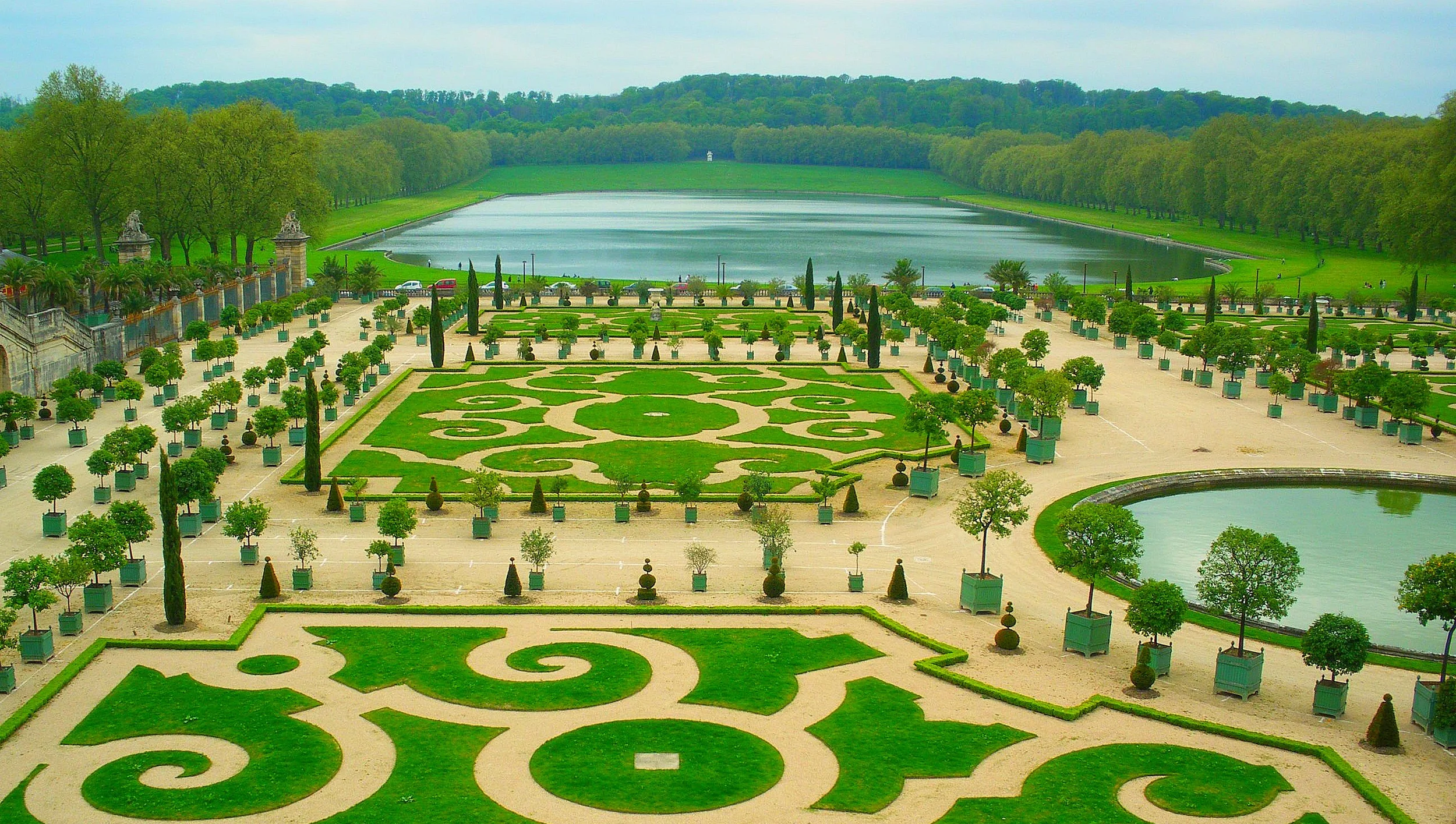 Intricately shaped and mowed lawns of the Orangerie in the Palace of Versailles. 