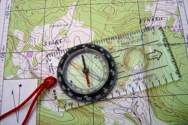 27234027-the-compass-lies-on-the-modern-world-map.jpg